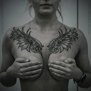 Chest wing tattoos.