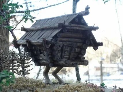 Дом на курьих ножках кошка на окошке