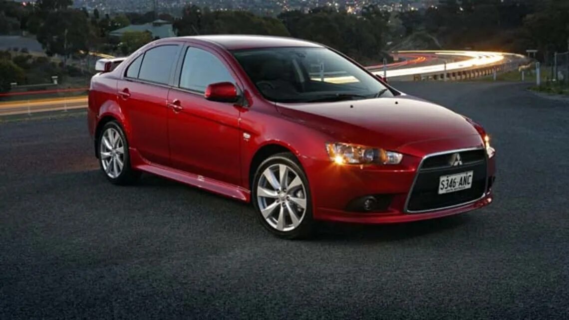 Mitsubishi lancer 2012. Митсубиси Лансер 2012. Митсубиси Круз. Шевроле Лансер 2012.