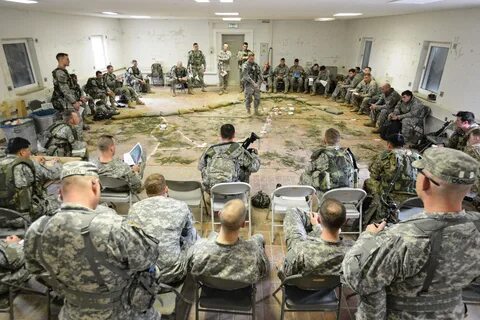 U.S. soldiers and paratroopers conduct a pre-mission brief for an air 