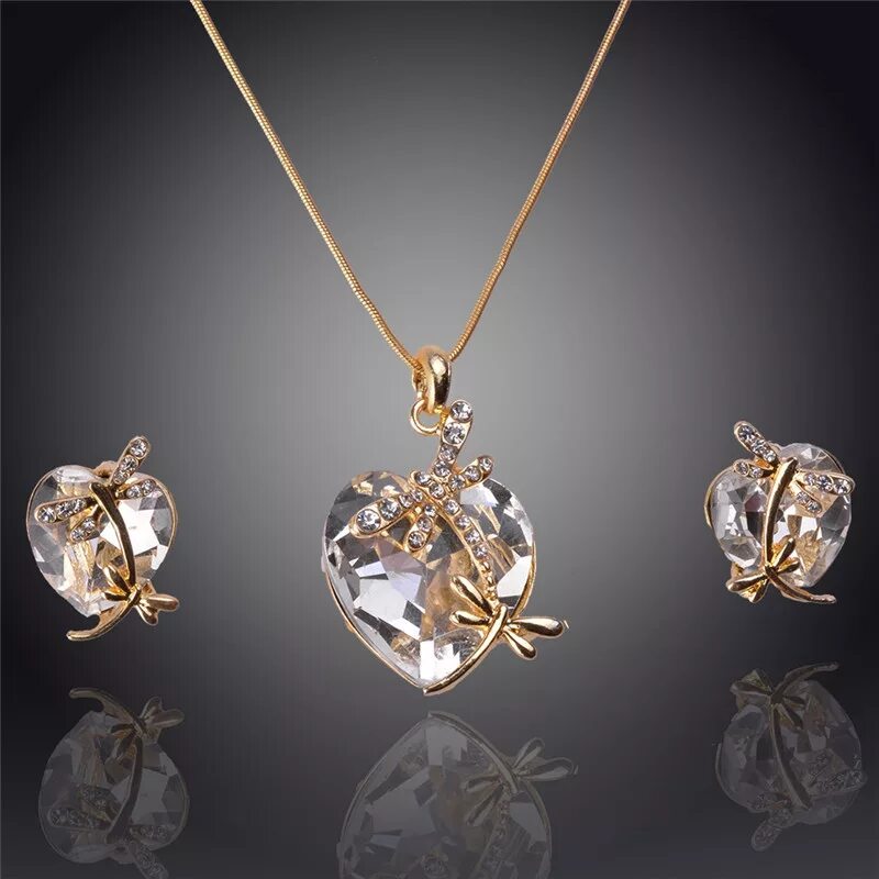 комплекты из золота с камнями. серьги с подвеской. серьги кольца. серьги джевелери серебро. золотой комплект.