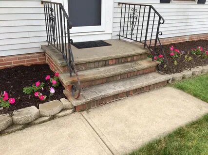 How to fill these large cracks/voids in this brick porch.