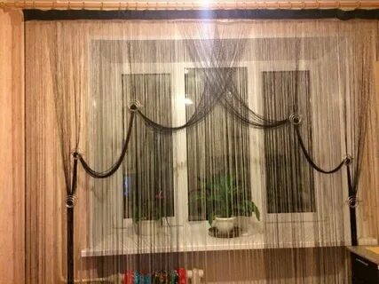На окно повесили тюль