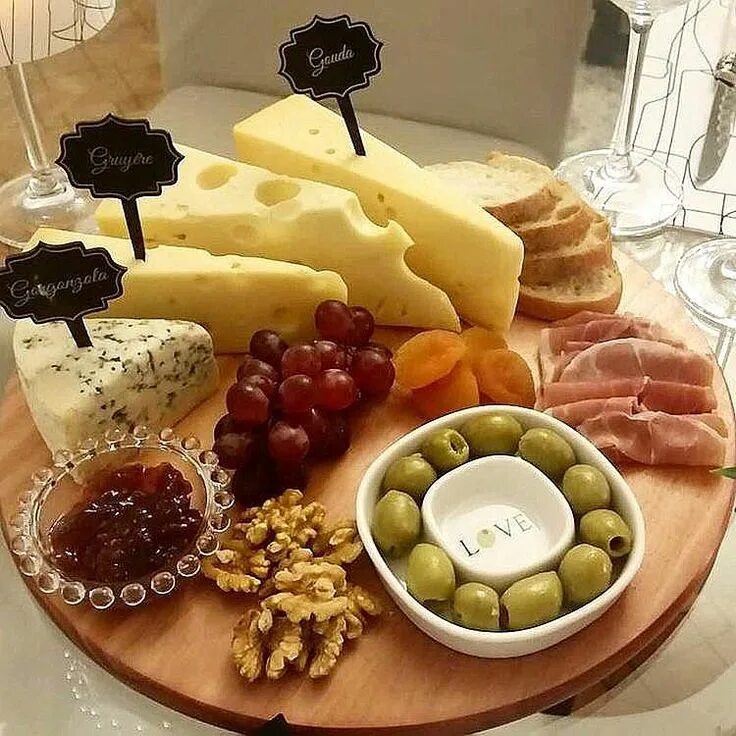 delicious appetizer to wine - ham, cheese, grapes, crackers, figs, nuts, jam, se