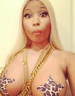 ATTENTION-OBSESSED Nicki Minaj has stripped off to expose 99.9% of her brea...