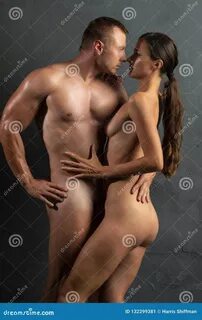Nude couple at a wall stock image. 