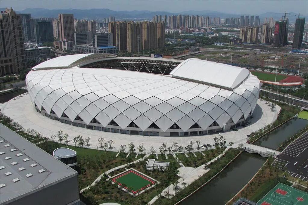 Center stadium. Стадион Китай 2023. Циндао стадион Тяньхан. Стадион Циндао Консон. Тяньцзинь Олимпик центр Стэдиум.