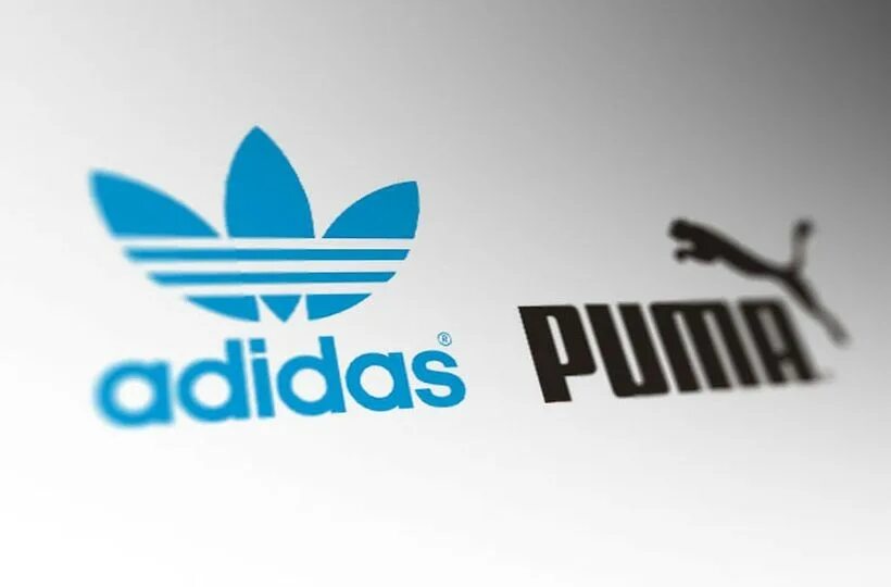 Логотип компании адидас и Пума. Компания Пума adidas. Адидас против Пумы. Пума Дасслер.