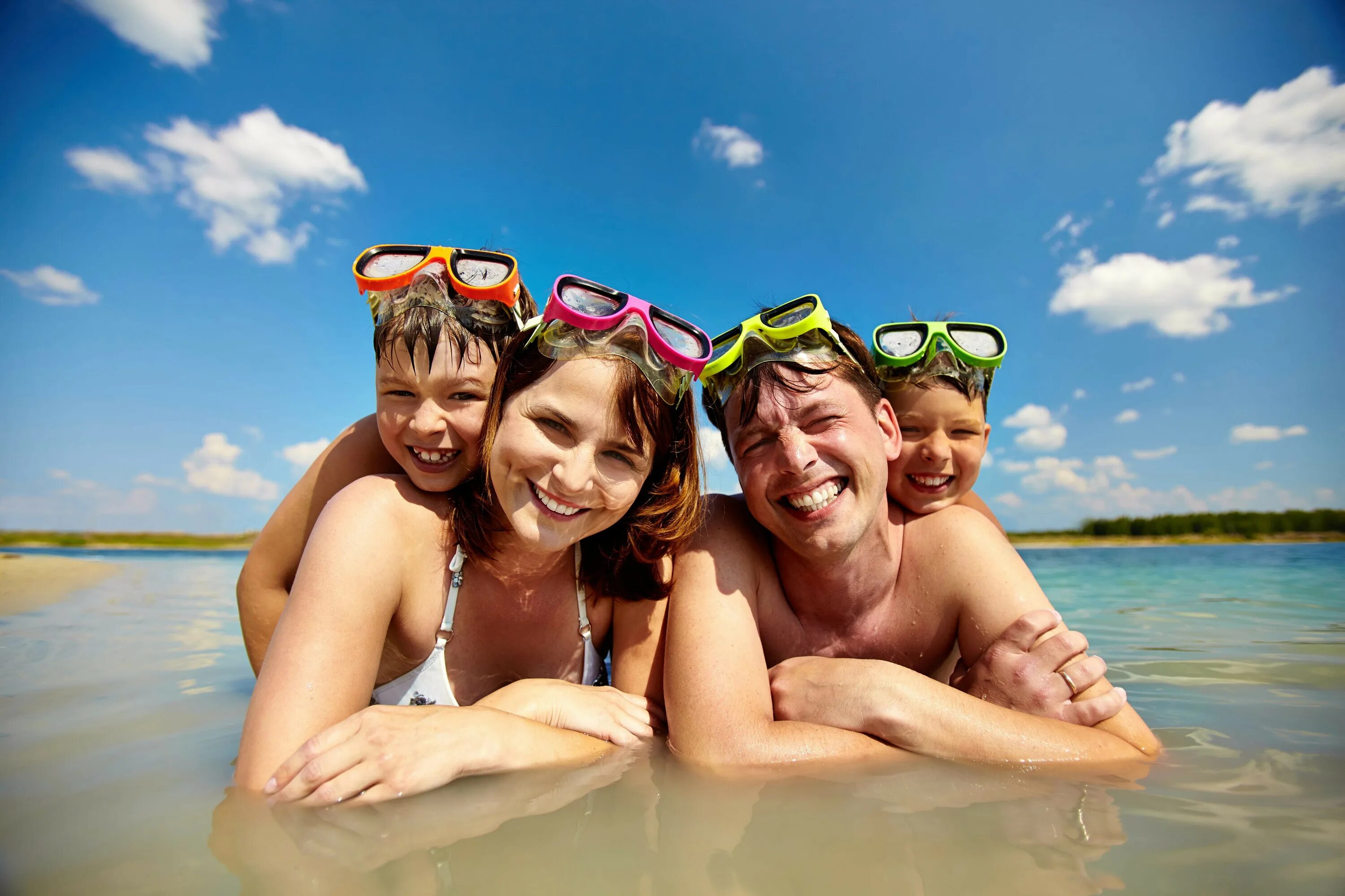 Hot holiday. Divers in the Water. Real Family Beach vacation. Affordable Beach vacations in December.