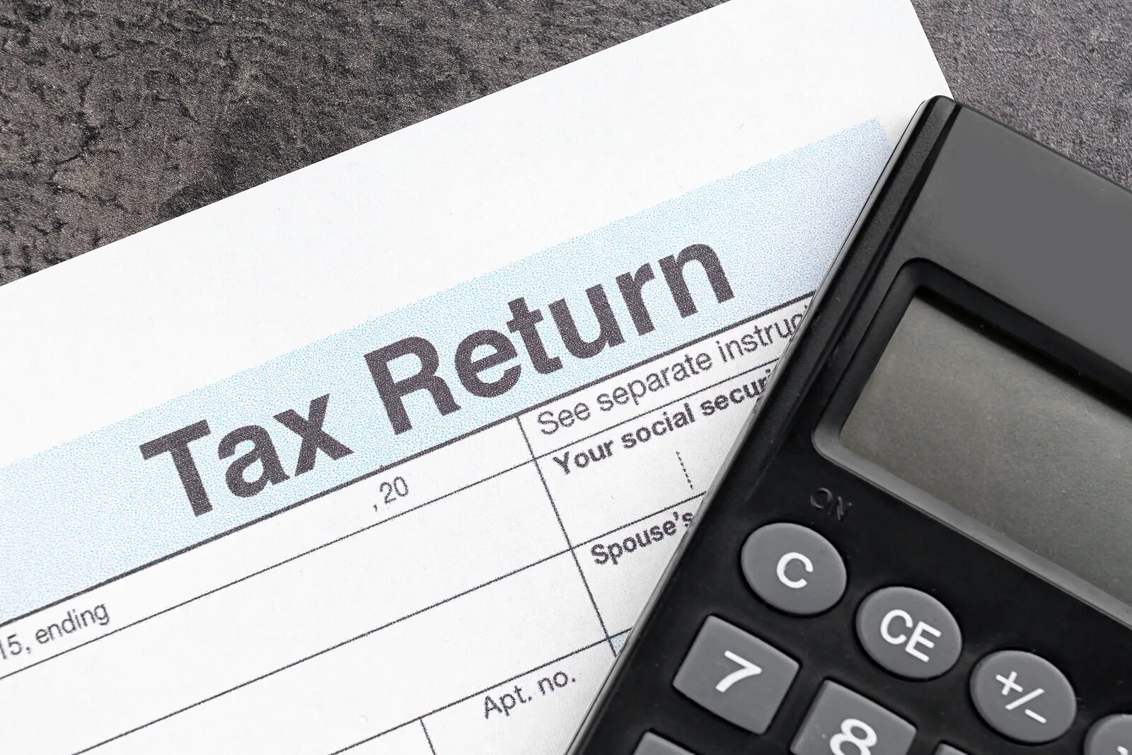 Фото Tax Return. Tax Return form. Profit Tax. Переключатели на калькуляторе profit - Tax.