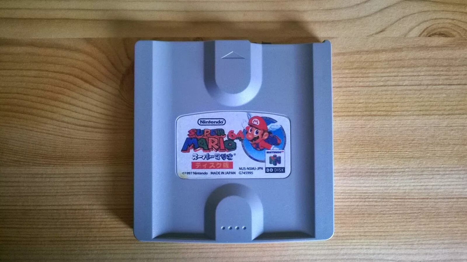 Nintendo 64 alex g текст. Nintendo 64dd. диск для nintendo 64. nintendo 64dd картриджи. super mario 64 disk.