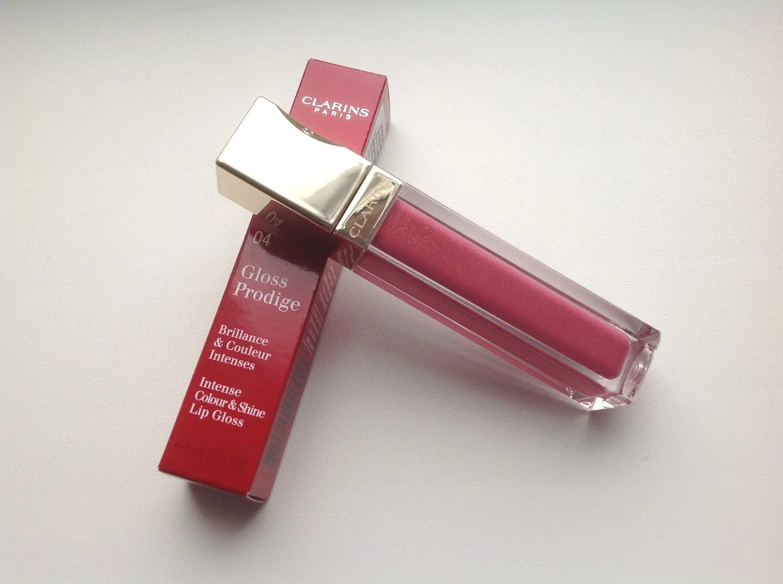 Упаковка для блеска для губ. Clarins Gloss prodige блеск для губ. Clarins 04 Candy. Clarins блеск 04. Candy 04 Clarins блеск.