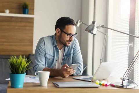 He is at home working