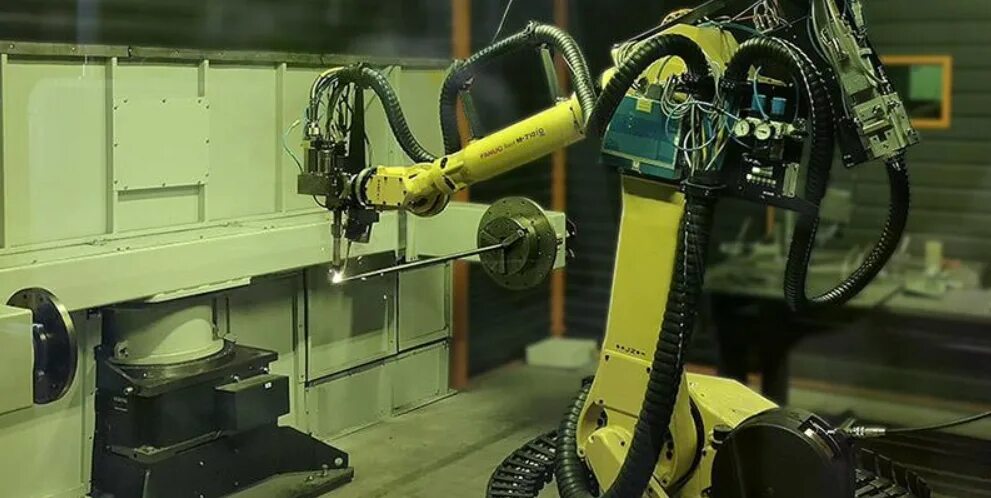 Комплекс роботизированной сварки. Роботизированный сварочный комплекс fanuc. сварочные роботы fanuc m-710. роботизированный сварочный комплекс на базе робота fanuc. лазерная сварка kuka.