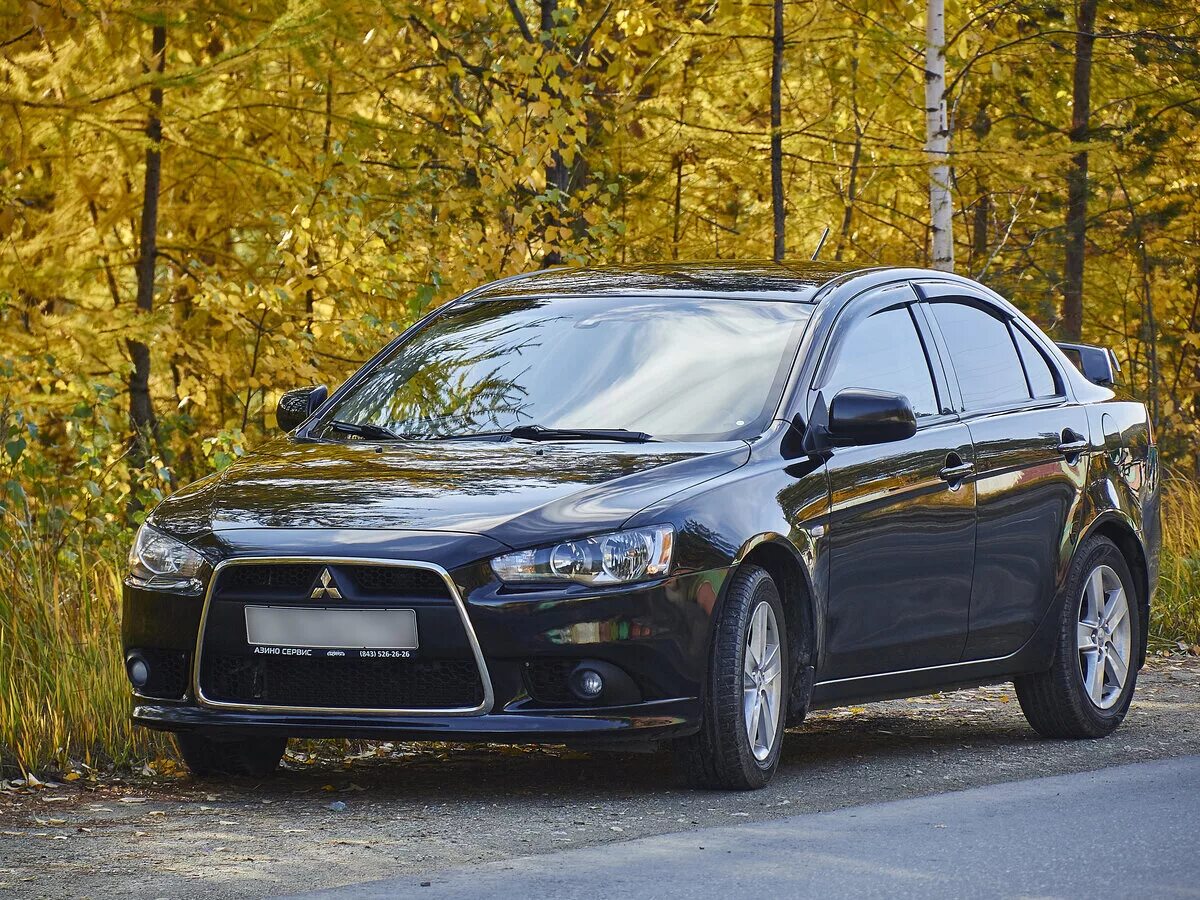 Mitsubishi lancer отзывы. Митсубиси Лансер 10. Митсубиши Лансер 2014. Mitsubishi Lancer 10 Black. Митсубиши Лансер 10 черный.