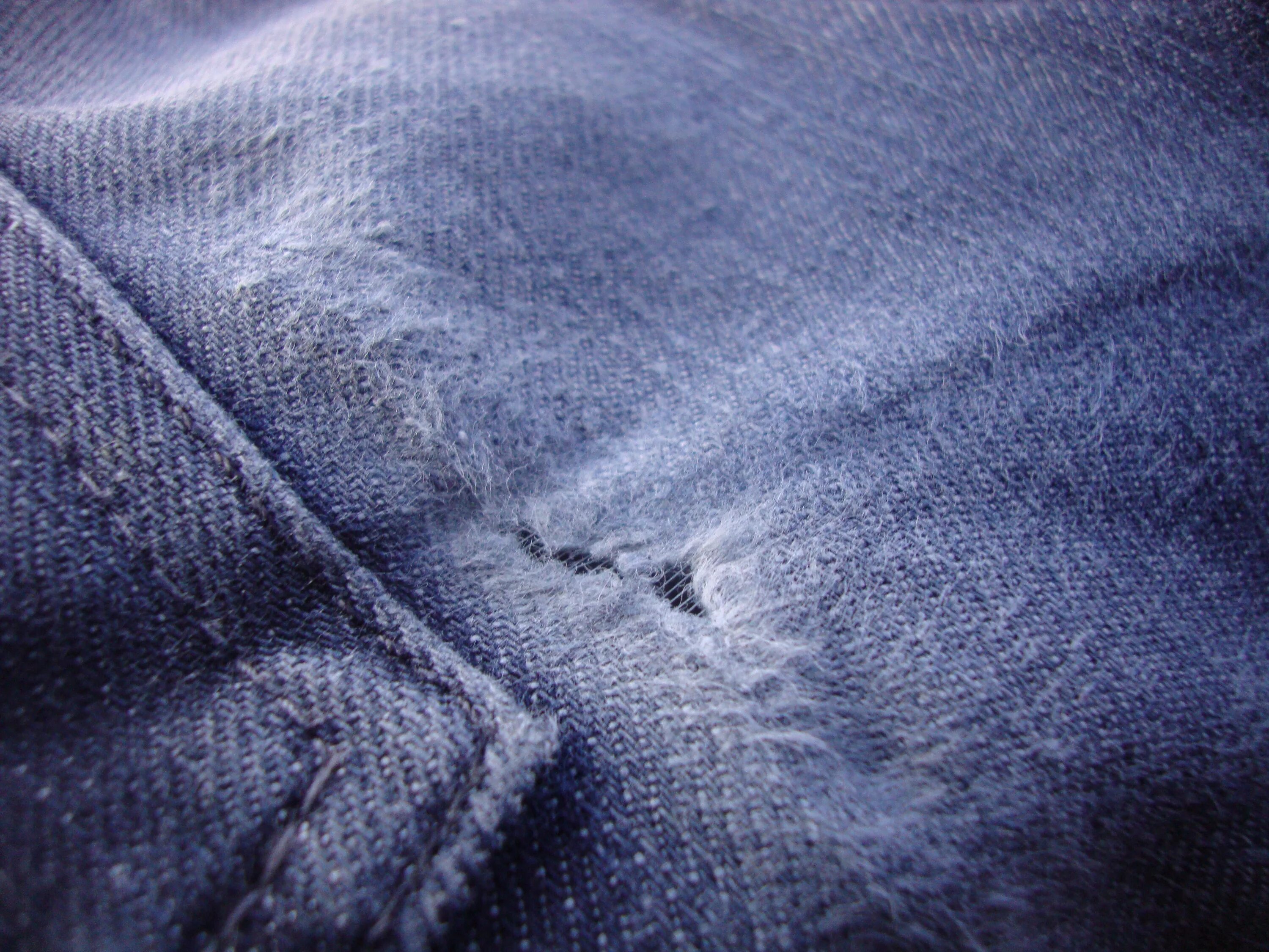 Worn clothes. Torn clothes texture. Real Wear and tear.