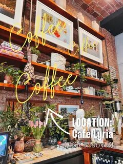 A cafe with a brick wall and shelves. 