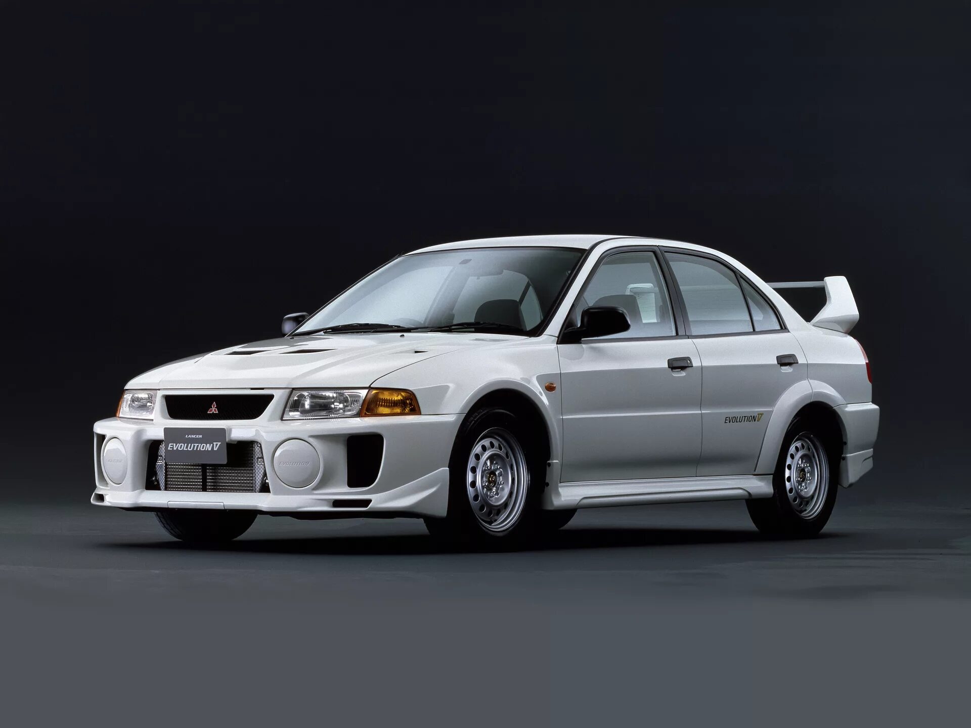 Митсубиси первого поколения. Mitsubishi Evolution 5. Lancer EVO 5. Mitsubishi Lancer Evolution 5 поколение. Mitsubishi Lancer Evolution 1998.