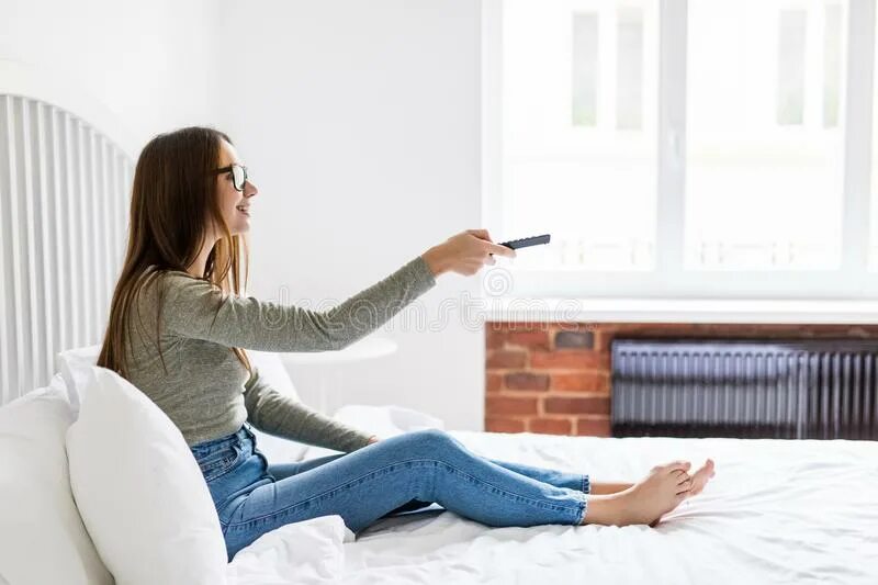 Tv woman девушка. Women using the remote control. Woman watching tv. Tv woman девушка. Женщина наблюдает.