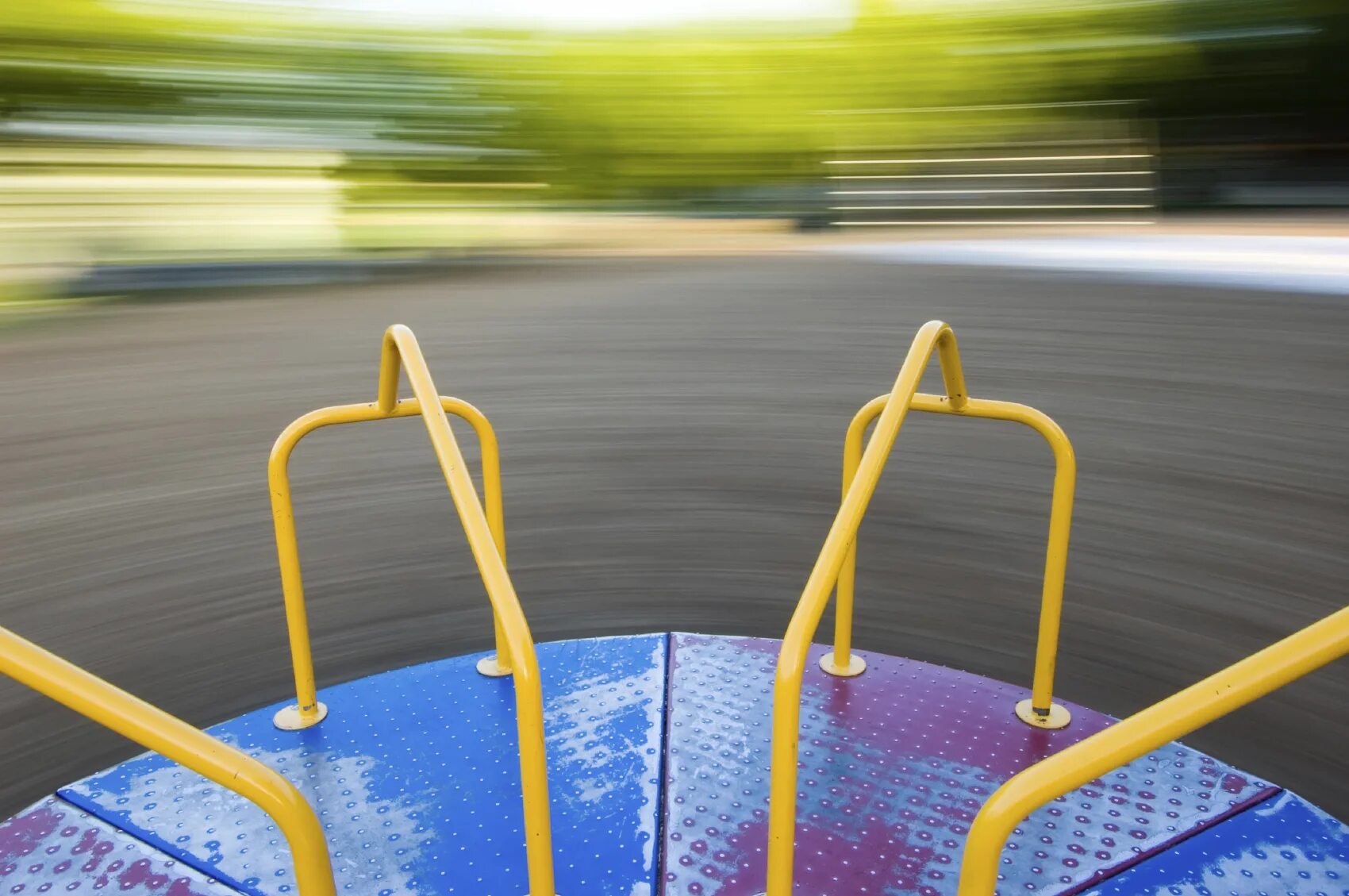 Electrostatic Drive- Merry go Round. Playground with Roundabout. A Group of Kids is Spinning on the Merry go Round. Playground Merry to go.