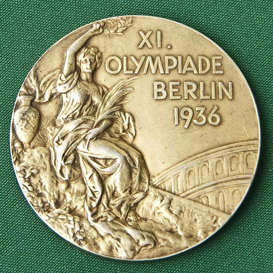 Олимпийские медали Берлин 1936. Медали Олимпийских игр 1936. Олимпийская медаль 1936.
