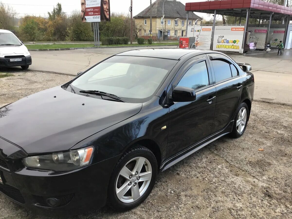 Lancer 10 2008 год. Митсубиси седан модели черные.