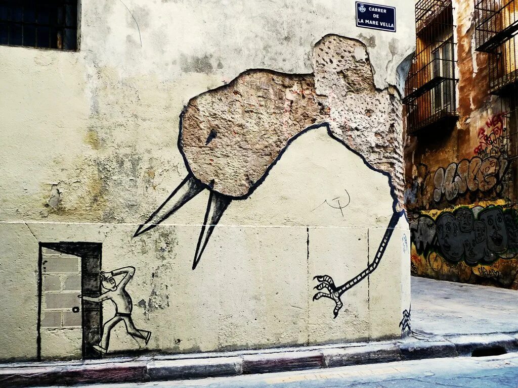 Стрит арт. Уличная живопись на стенах. Уличный стрит арт. Граффити на стене. Рисунок на стене улица