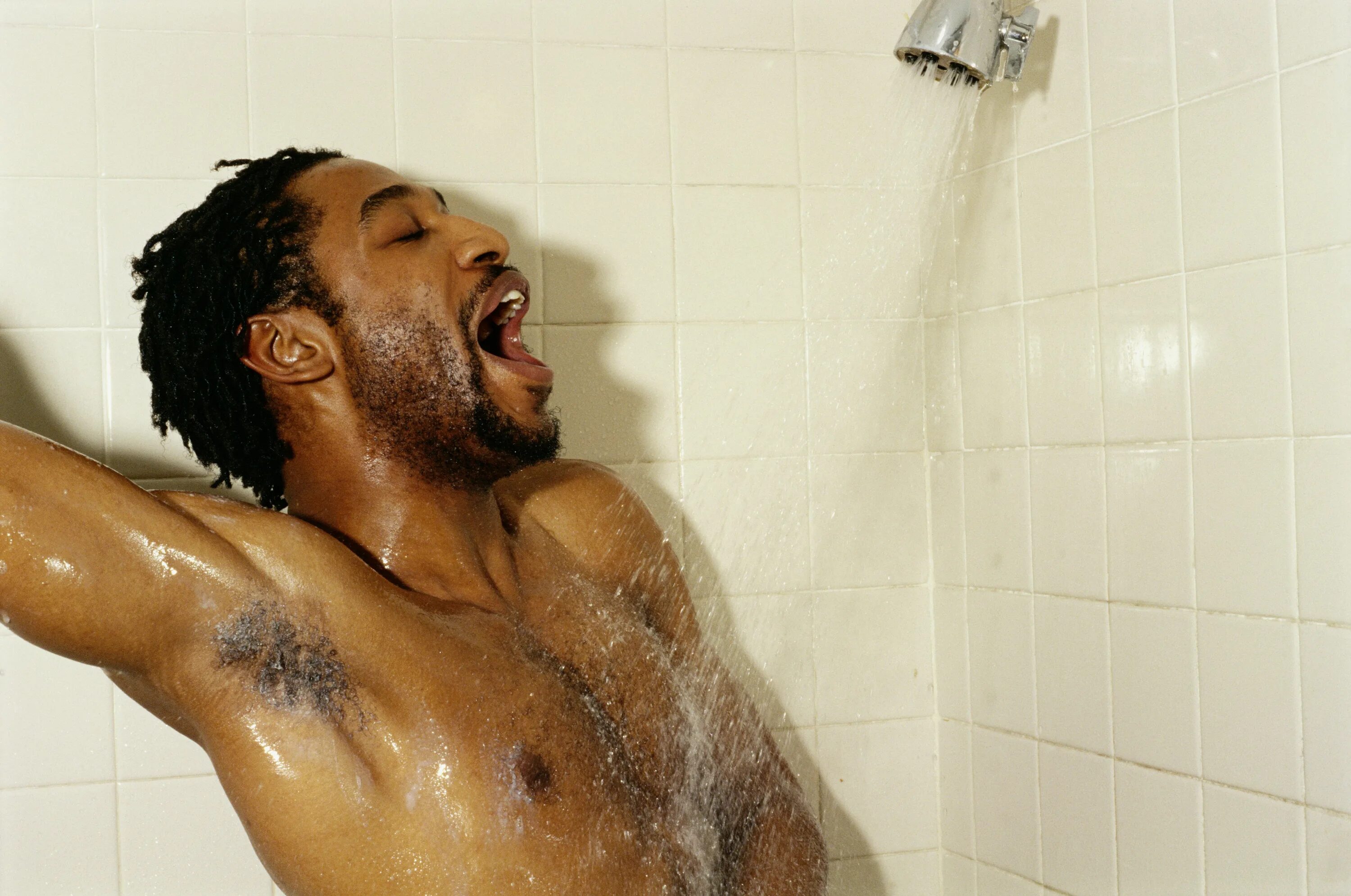 Man singing in Shower. Showering man.