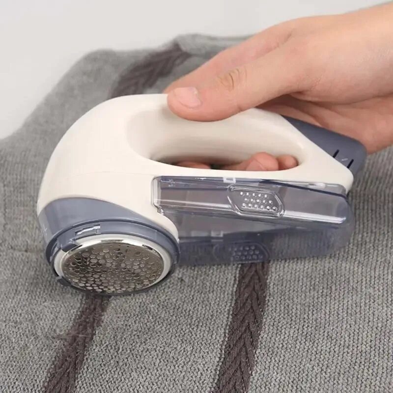 Удалитель катышков с одежды. Lint remover bo-1789 braun. бритва для катышков на одежде. машинка для катышков. машинка для убирания катышек.