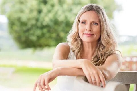 rectangle face blonde curls middle aged woman. 
