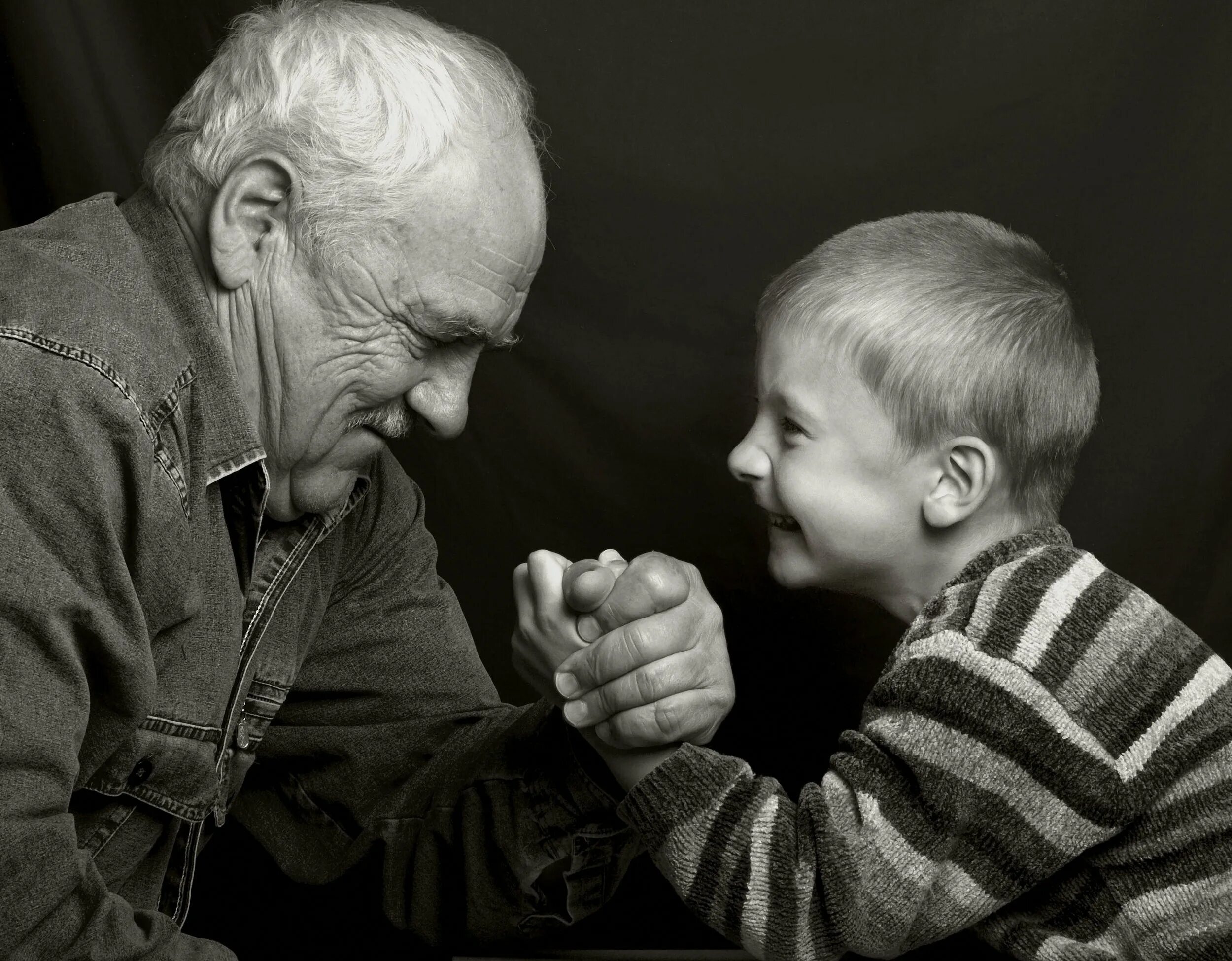 Standing old man and child. Grandson learn oldman. Old man child