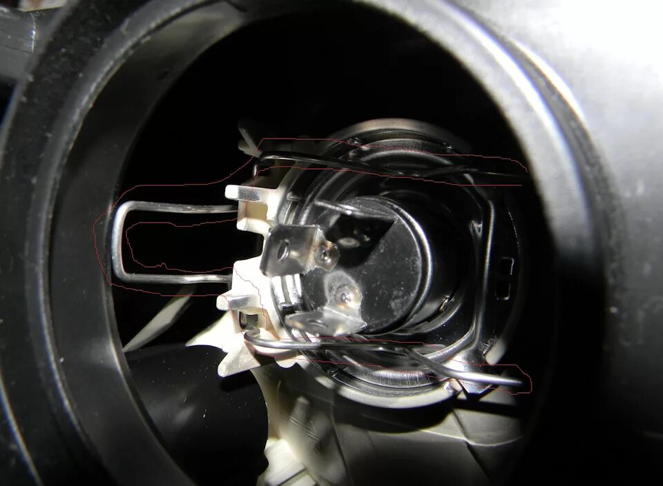 Replacing the low beam headlight bulb.