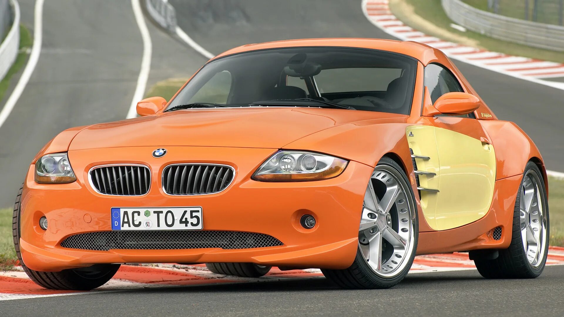 Сайт про машины. BMW z4 оранжевая. BMW z4 2003. Шницер БМВ. BMW z3 оранжевый.