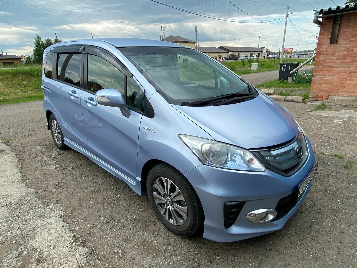 Фрид 2012 года гибрид. Honda freed 2012. Хонда Фрид i 2012. Хонда Фрид 2012 голубой. Хонда 6 местная правый руль гибрид.