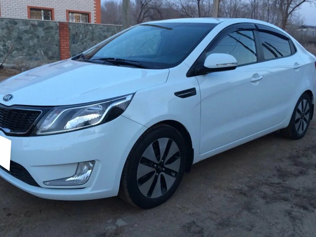 Купить б/у Kia Rio III 1.4 MT (107 л.с.) бензин механика в Воронеже: серый Киа Р