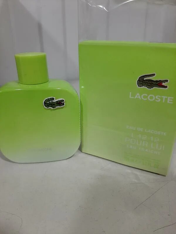 Духи лакосте зеленые. Lacoste l.12.12 pour lui Eau Fraiche. Lacoste l.12.12 Blanc Eau Fraiche. Лакост зеленый 100 мл. Lacoste туалетная вода l.12.12 Eau Fraiche pour lui пирамида.