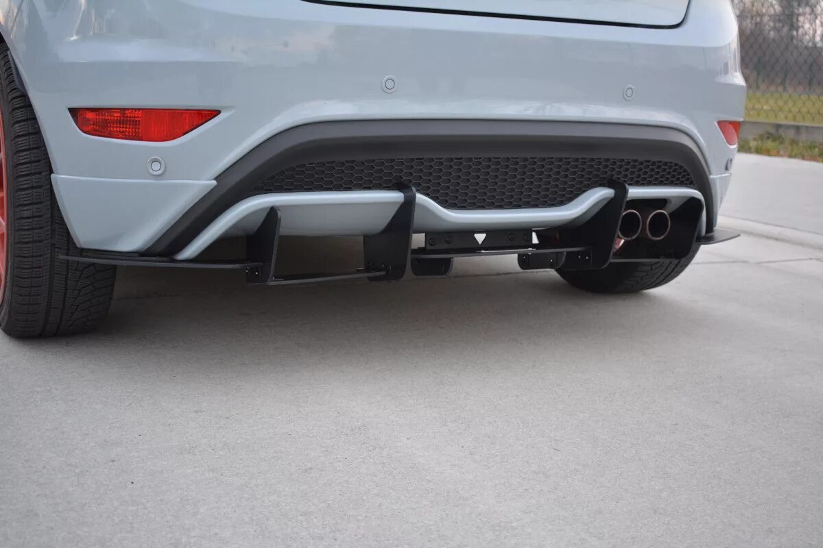 Fiesta St mk7 Rear Bumper. Задний диффузор Ford Explorer St. Диффузор задний на Форд Куга 2. Задний бампер Fiesta St mk7.