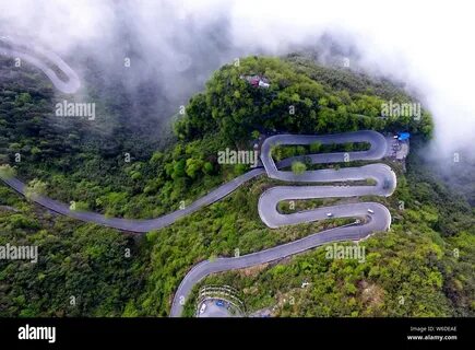 Aerial view of a winding mountain road in Jishou city, Xiangxi Tujia and Mi...