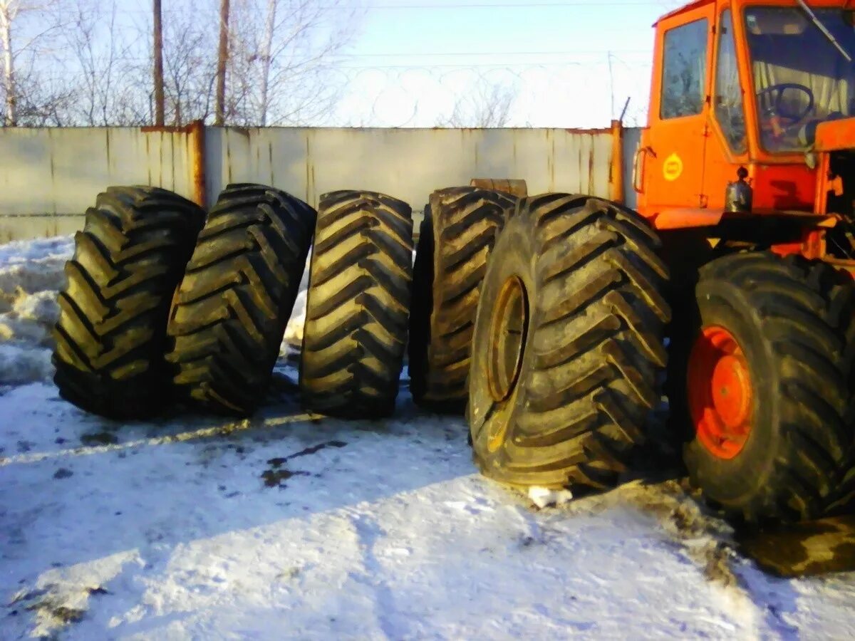 Купить колеса трактор бу. Т 150 на колесах к 700. Шины на трактор т 150 Размеры. Т-150 трактор шины. Колесо т150.