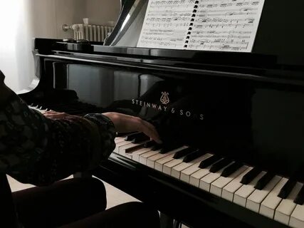 John playing the piano