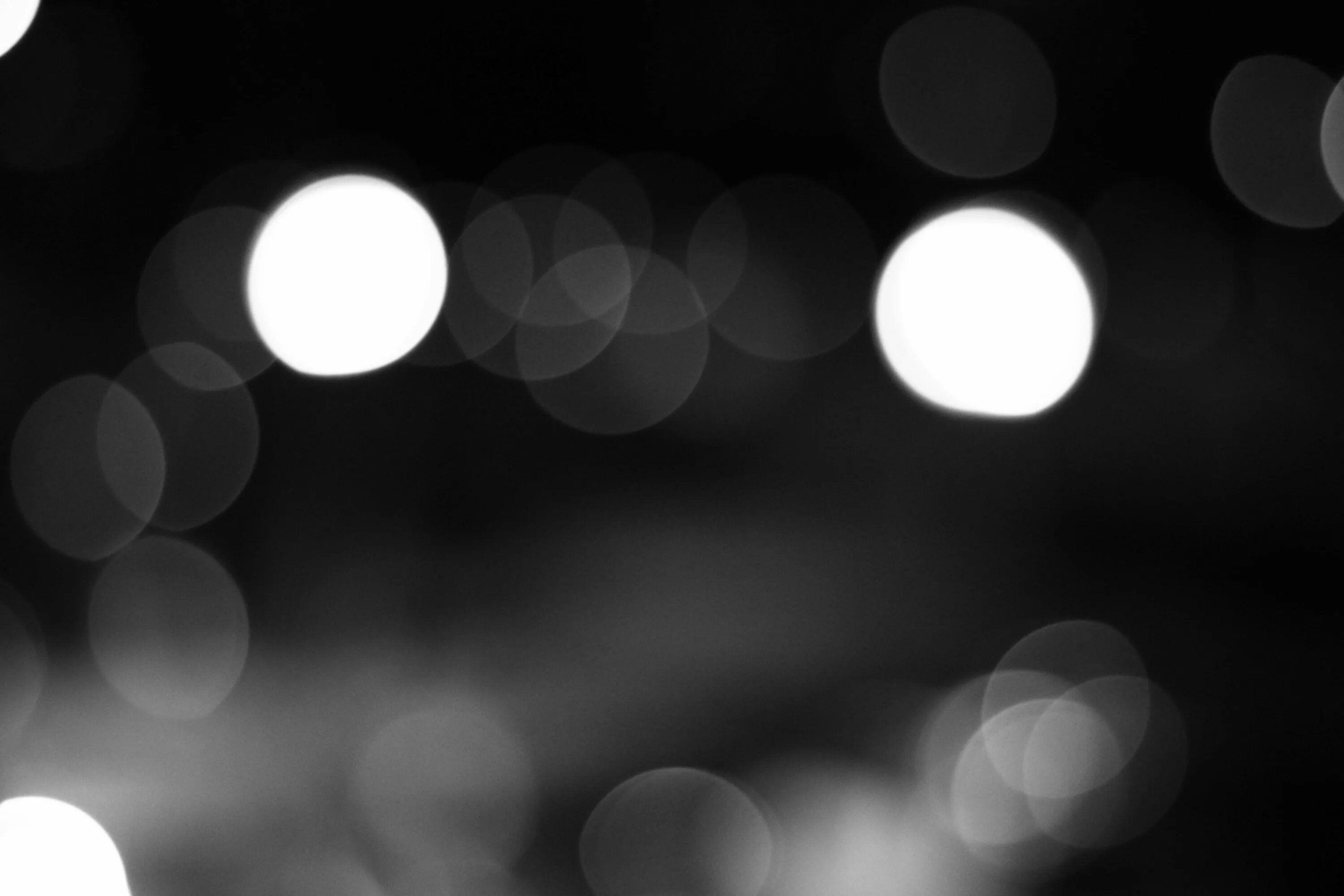 Блики на черном фоне. Световое пятно на черном фоне. Свет на черном фоне. Темный блик. Фон блики.