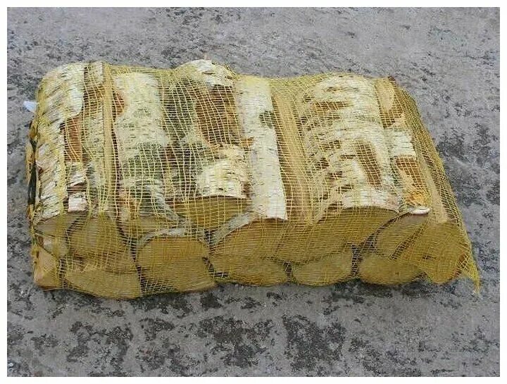 ольховые дрова в сетках. поленья в сетке. упаковка дров в сетки. дрова березовые в сетке. дрова дубовые в сетках.