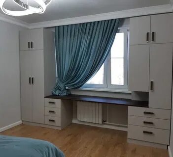 Шкаф вдоль окна в детской