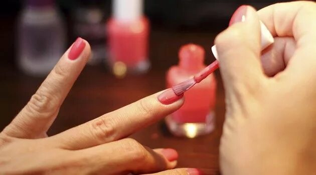 Nails Painted Red Nail Polish in a Beauty Salon Stock Image - Image of fingernai