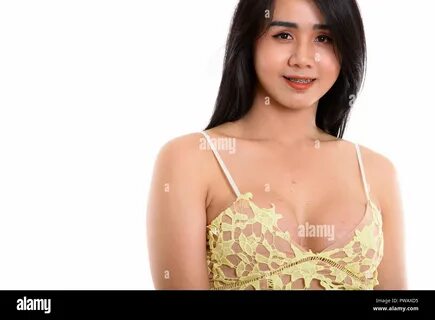 Studio shot of young happy Asian transgender woman smiling while Stock Phot...