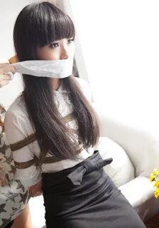 Asian girl gagged.