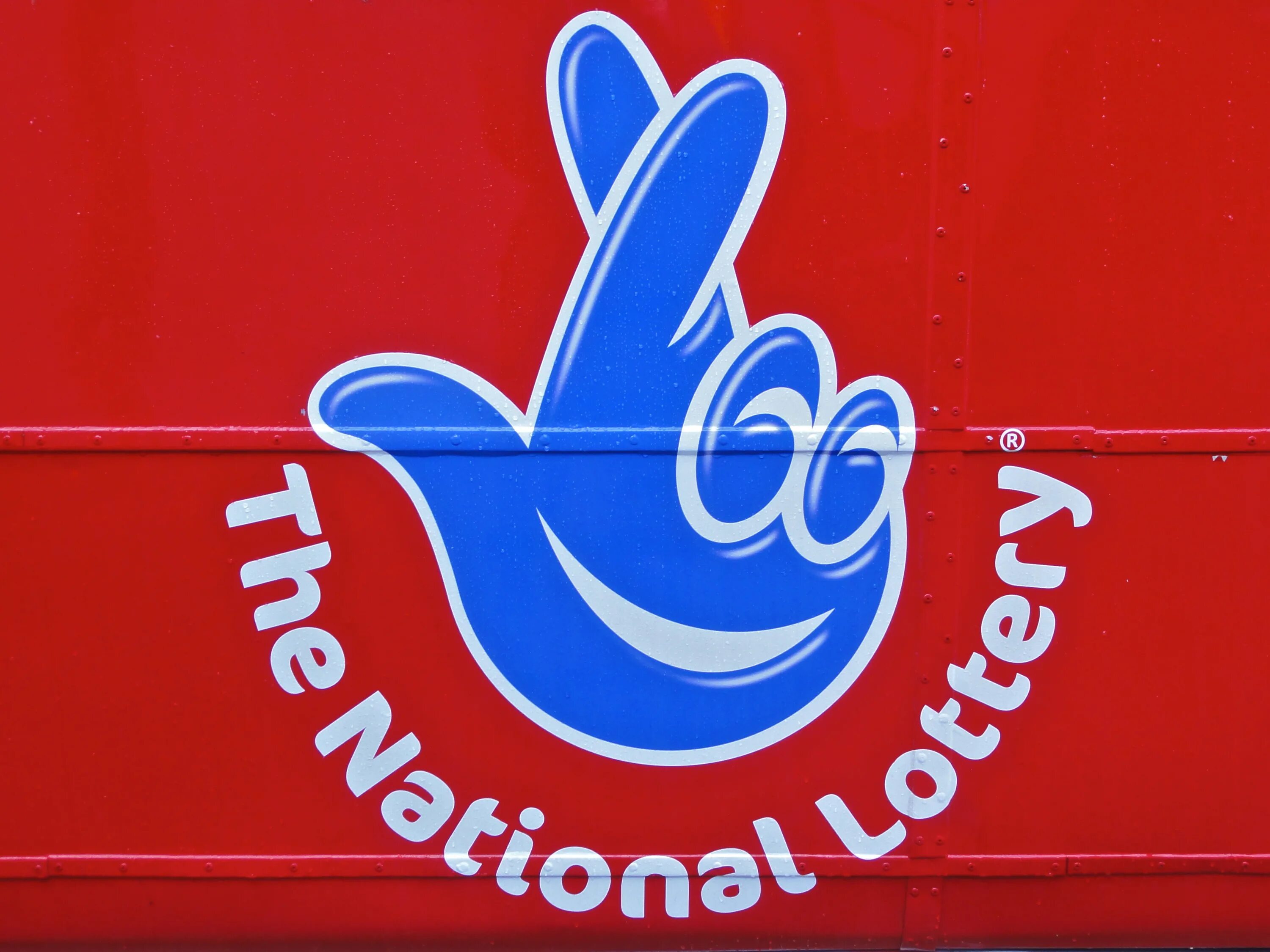 Национальная лотерея установить. Национальная лотерея. Британская Национальная лотерея. Национальная лотерея лого. Логотип британской лотереи.