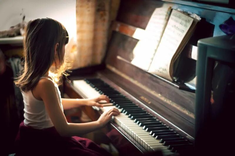 Playing the Piano. Play the Piano. Girl playing Piano. Piano at Home. Sister play piano