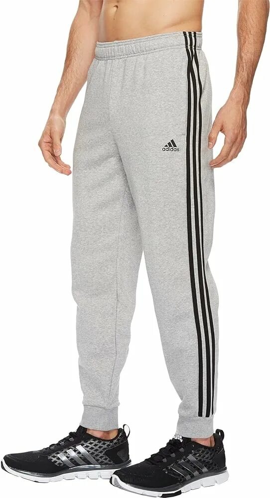 Мужское трико на валберис. 3 Stripes Jogger адидас. Брюки спортивные adidas Essentials Tapered Joggers. Спортивные штаны адидас серые мужские. Брюки адидас мужские серые.