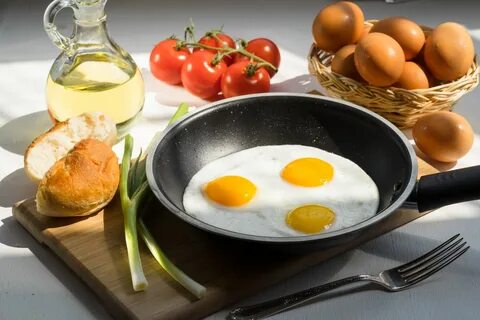 An egg on the there plate is